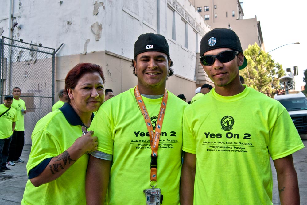 Image of three Alt 2 supporters wearing shirts that read 'Yes on 2.'